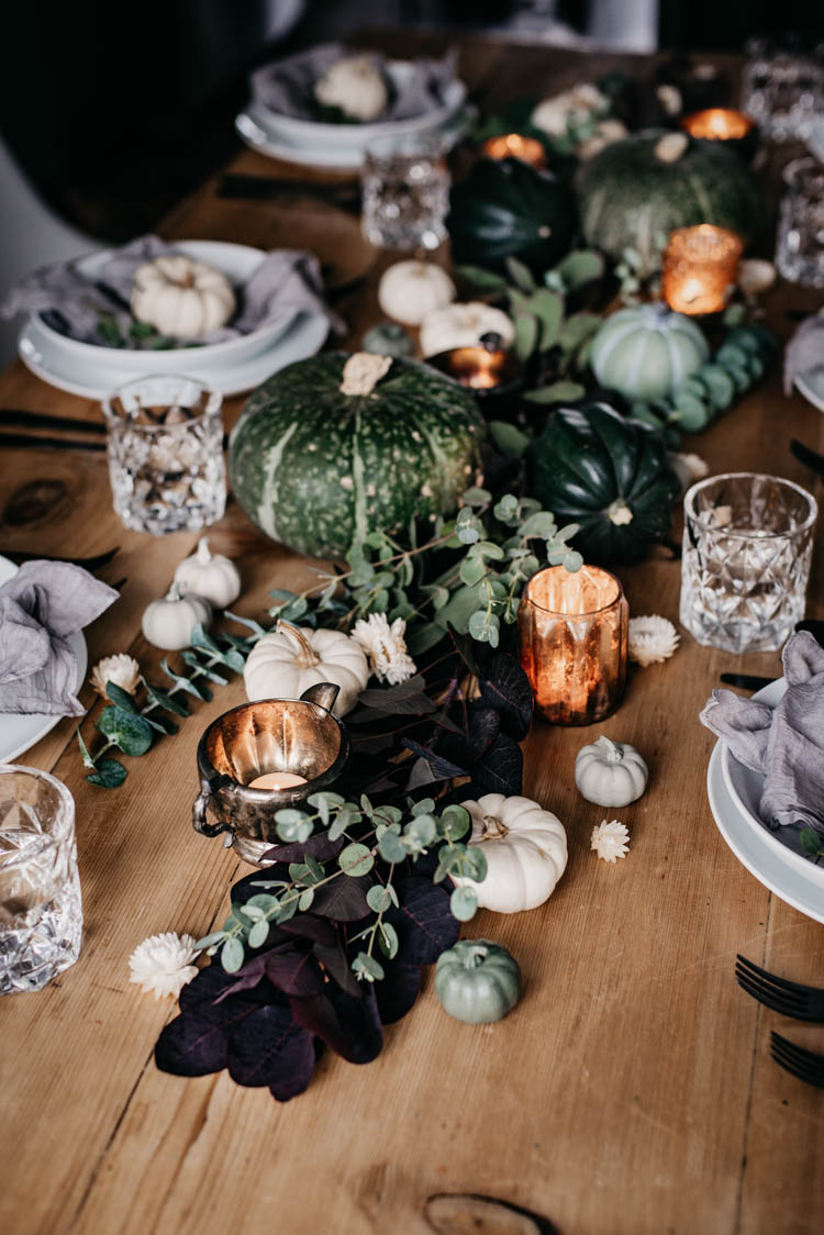 Beautiful green autumn tablescape with hand lettered pumpkin place cards for thanksgiving