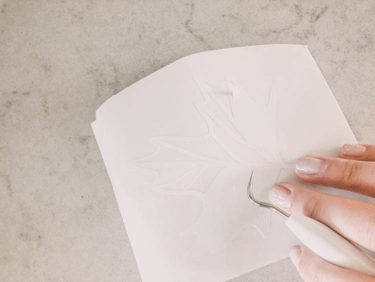 Weeding the Free line art leaf cut file for the DIY sign
