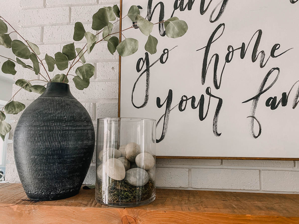 vase full of concrete look easter eggs on mantel