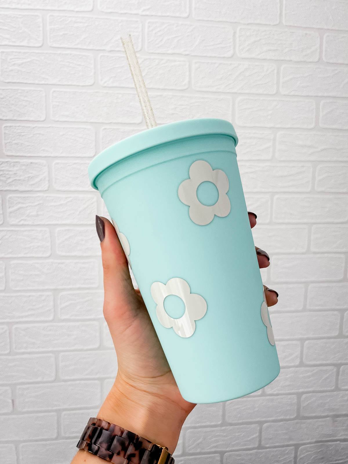 blue tumbler with tan flowers- cricut permanent adhesive vinyl