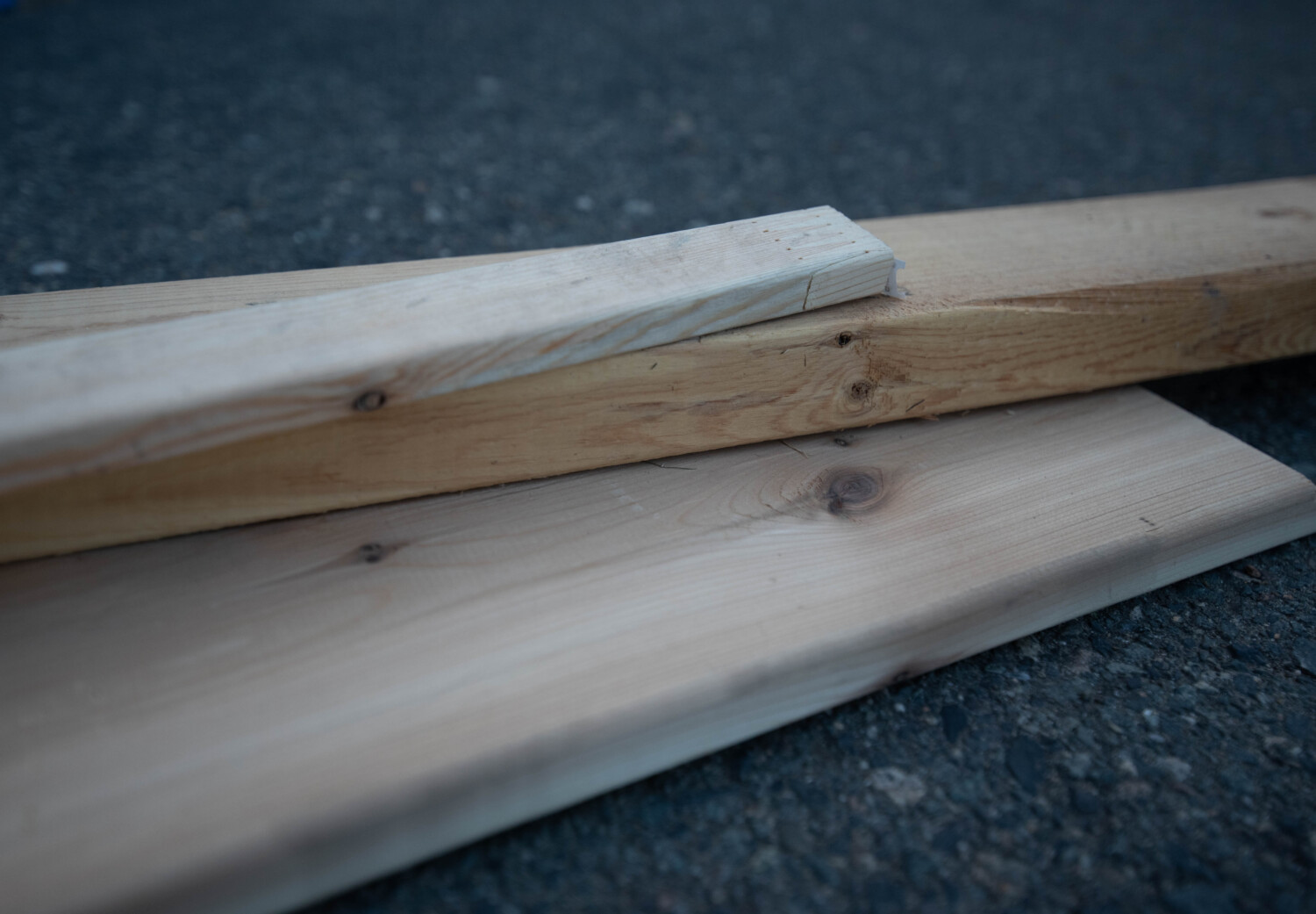 Image shows a stack of various wood boards image from blog post thats a introduction to the types of wood available for DIY projects