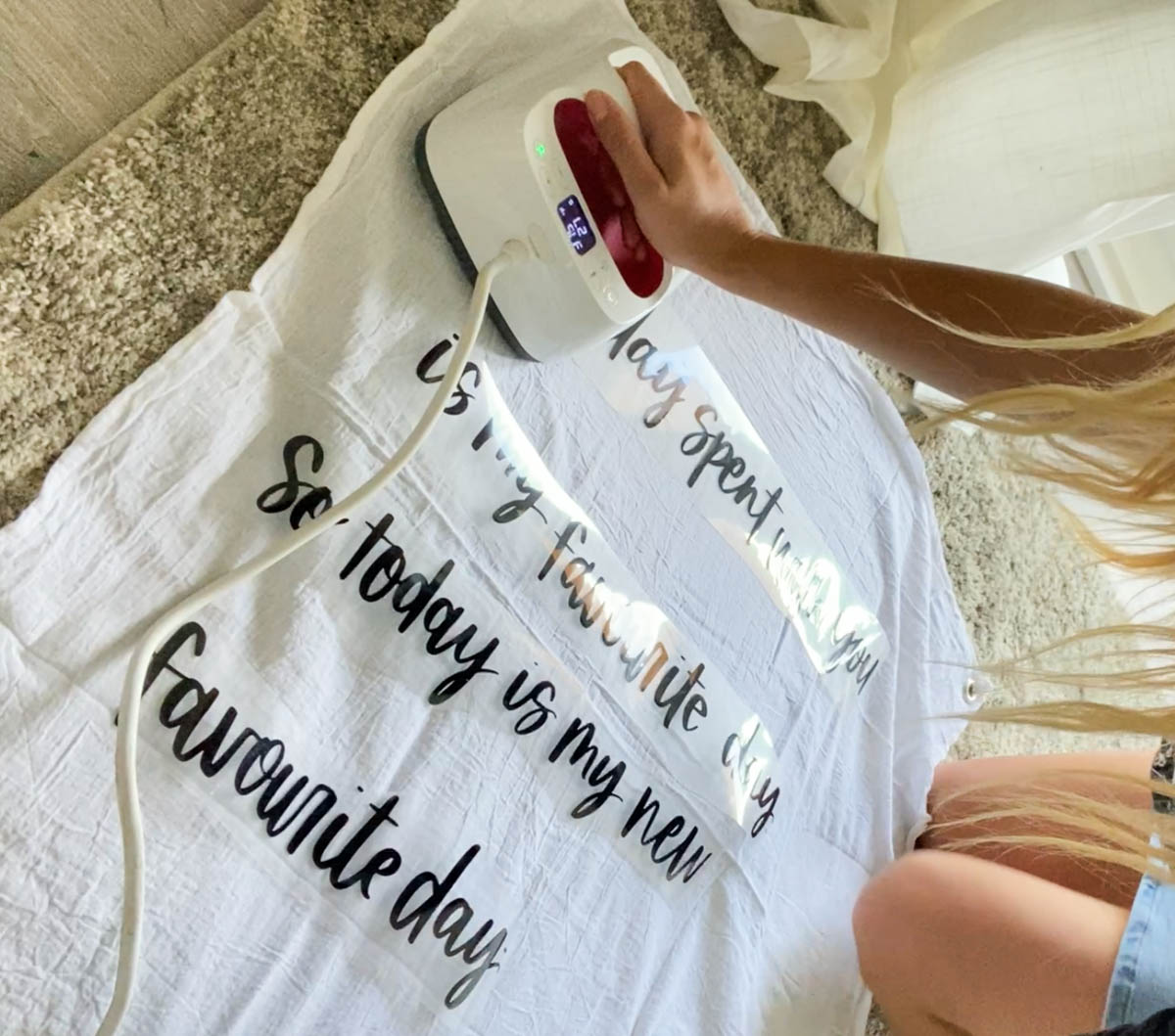 DIY wall flag tutorial image of process: ironing on lettering to flag with an easy press