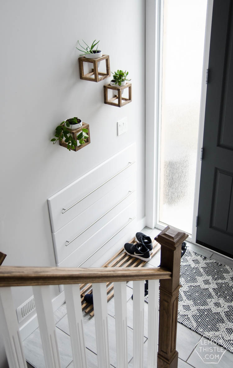 DIY Split Level Entry Makeover- I LOVE this entry. The oversize door, scandi influence and that shoe storage!