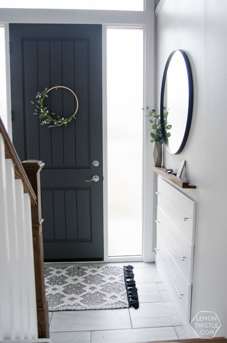 DIY Split Level Entry Makeover- I LOVE this entry. The oversize door, scandi influence and that shoe storage!
