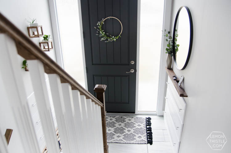 DIY Split Level Entry Makeover- I LOVE this entry. The oversize door, scandi influence and that shoe storage!