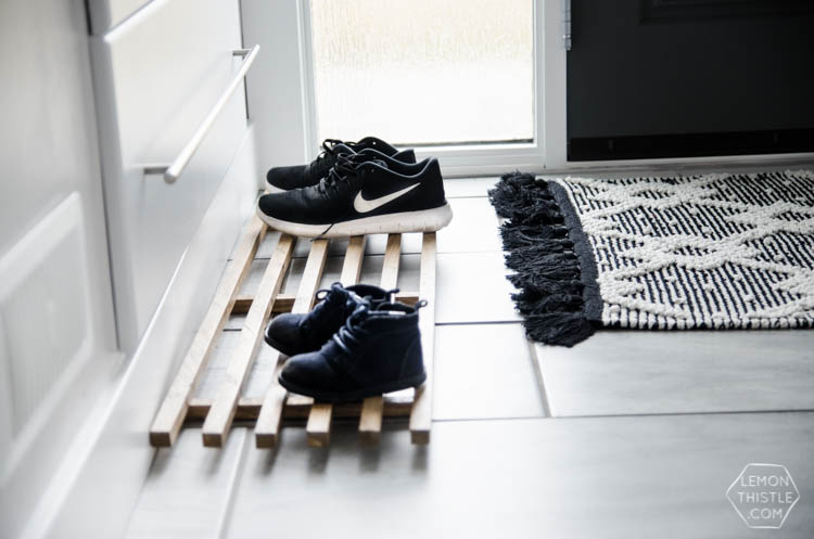 DIY Split Level Entry Makeover- I LOVE this entry. The oversize door, scandi influence and that shoe storage!