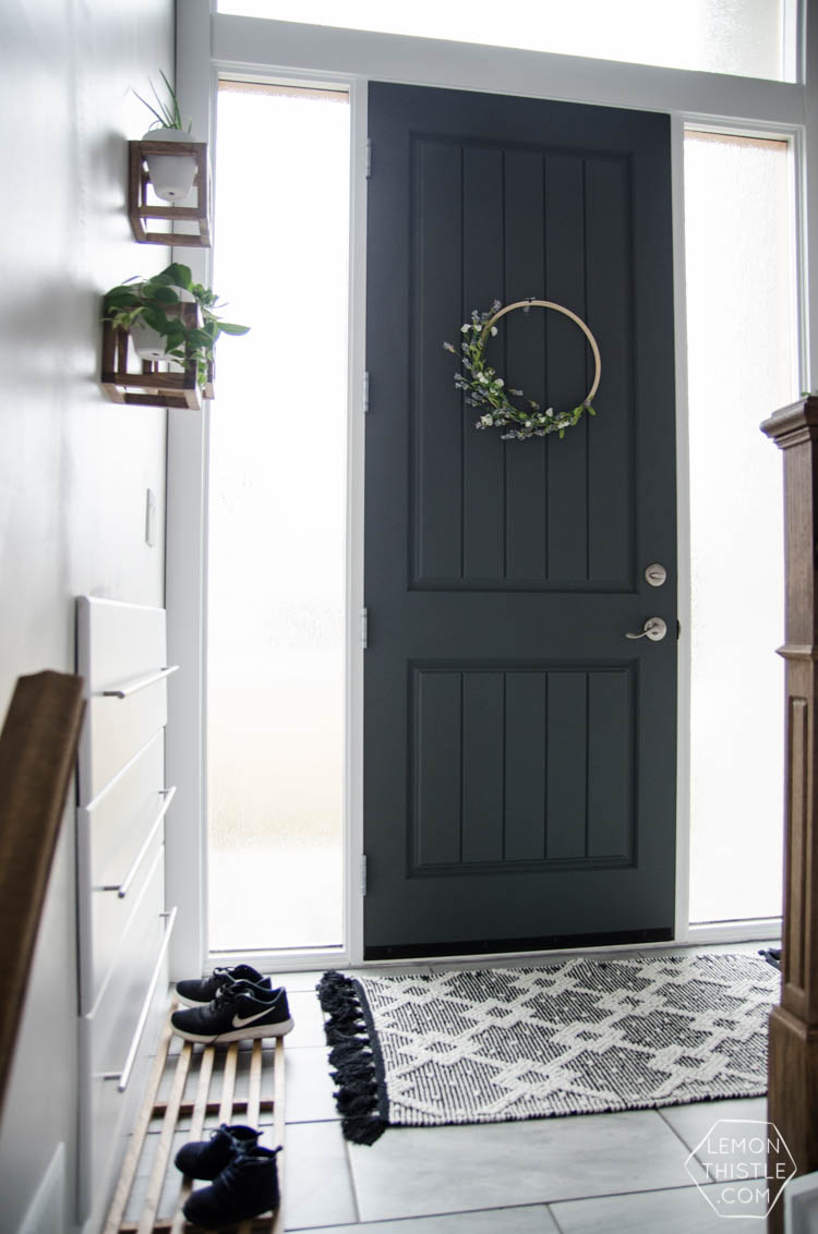 DIY Split Level Entry Makeover- I LOVE this entry. The oversize door, scandi influence and that shoe storage!