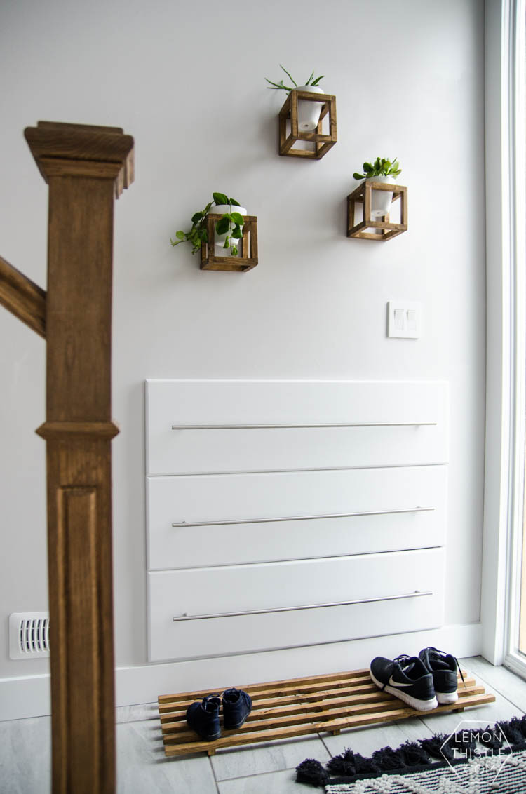 DIY Split Level Entry Makeover- I LOVE this entry. The oversize door, scandi influence and that shoe storage!