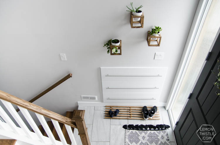 DIY Split Level Entry Makeover- I LOVE this entry. The oversize door, scandi influence and that shoe storage!