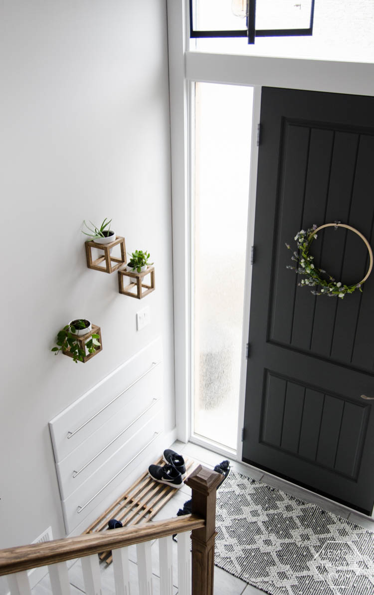 DIY Split Level Entry Makeover- I LOVE this entry. The oversize door, scandi influence and that shoe storage!