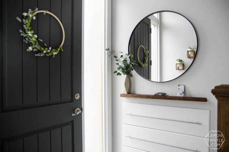 DIY Split Level Entry Makeover- I LOVE this entry. The oversize door, scandi influence and that shoe storage!