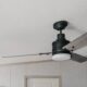 Beautiful farmhouse style fan on a sloped ceiling- great tips to install it on an angled ceiling