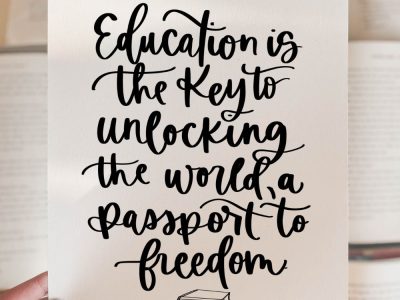 Education is the key to unlocking the world, a passport to freedom. Free printable quote held over books
