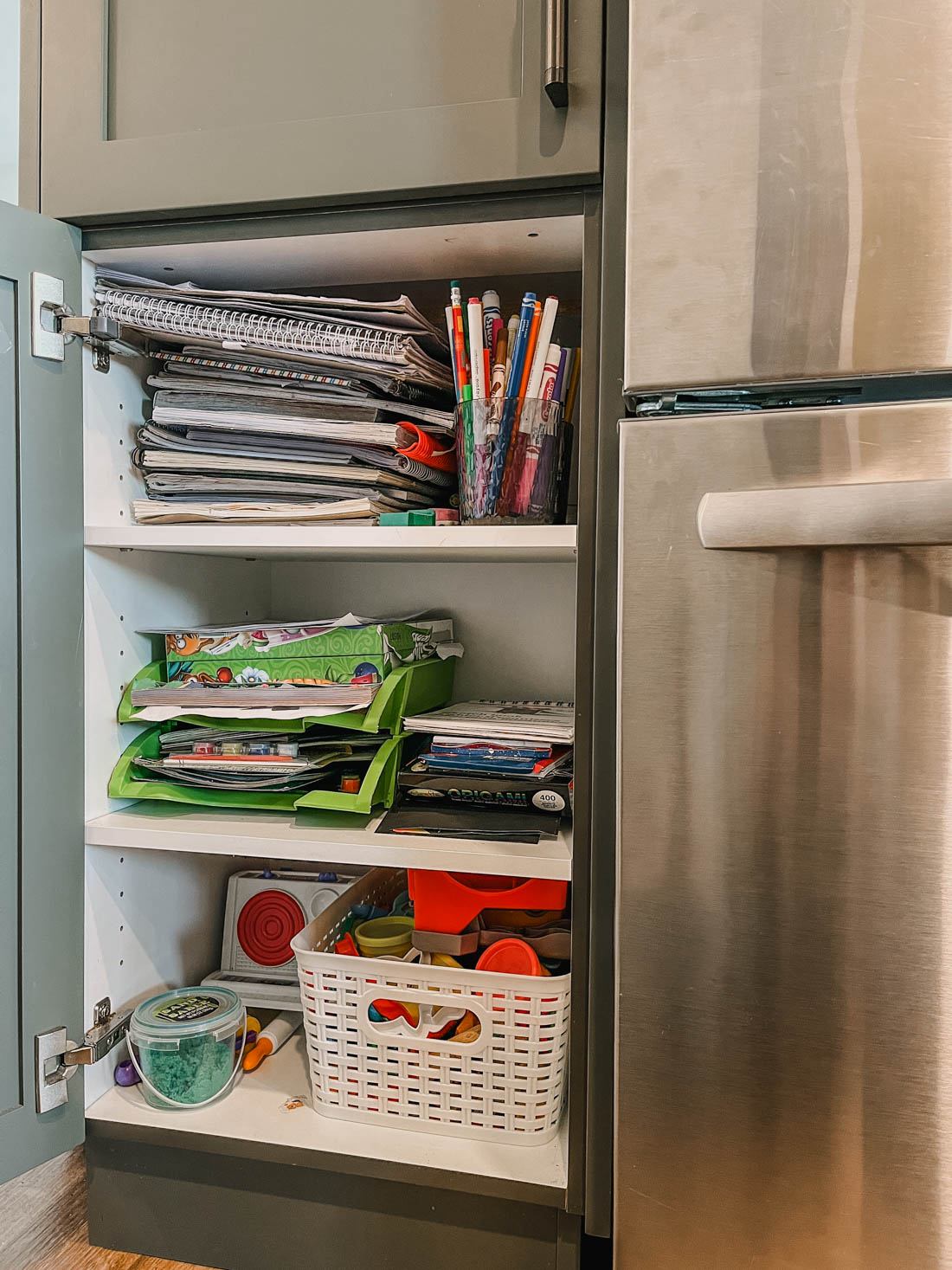 Kids craft cupboard in the kitchen