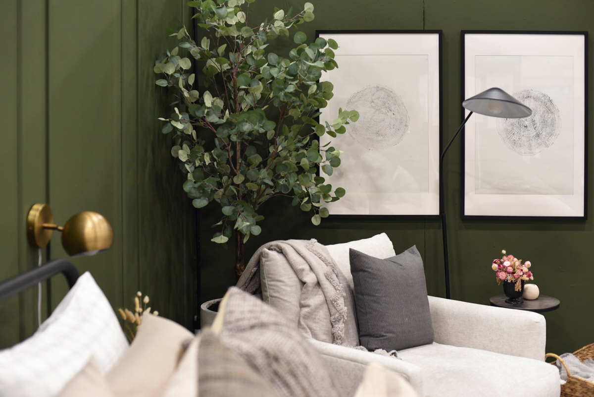 Cozy green bedroom with DIY wood round prints