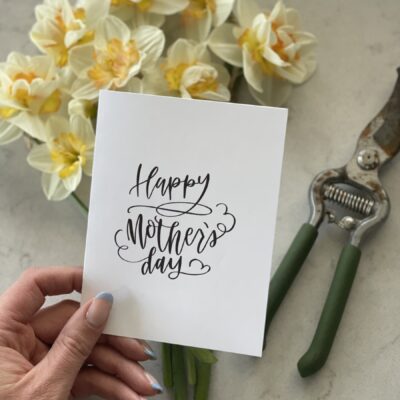 Hand lettered mothers day card with daffodils