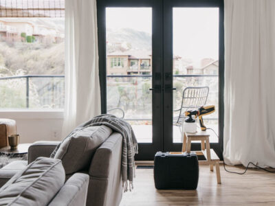How we painted our patio doors black (including masking off the living room!) and the before and after- it makes SUCH a big difference in the feel of the space