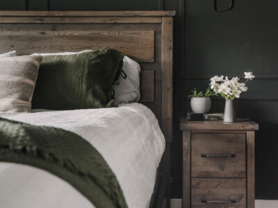 Black bedroom with wood furniture