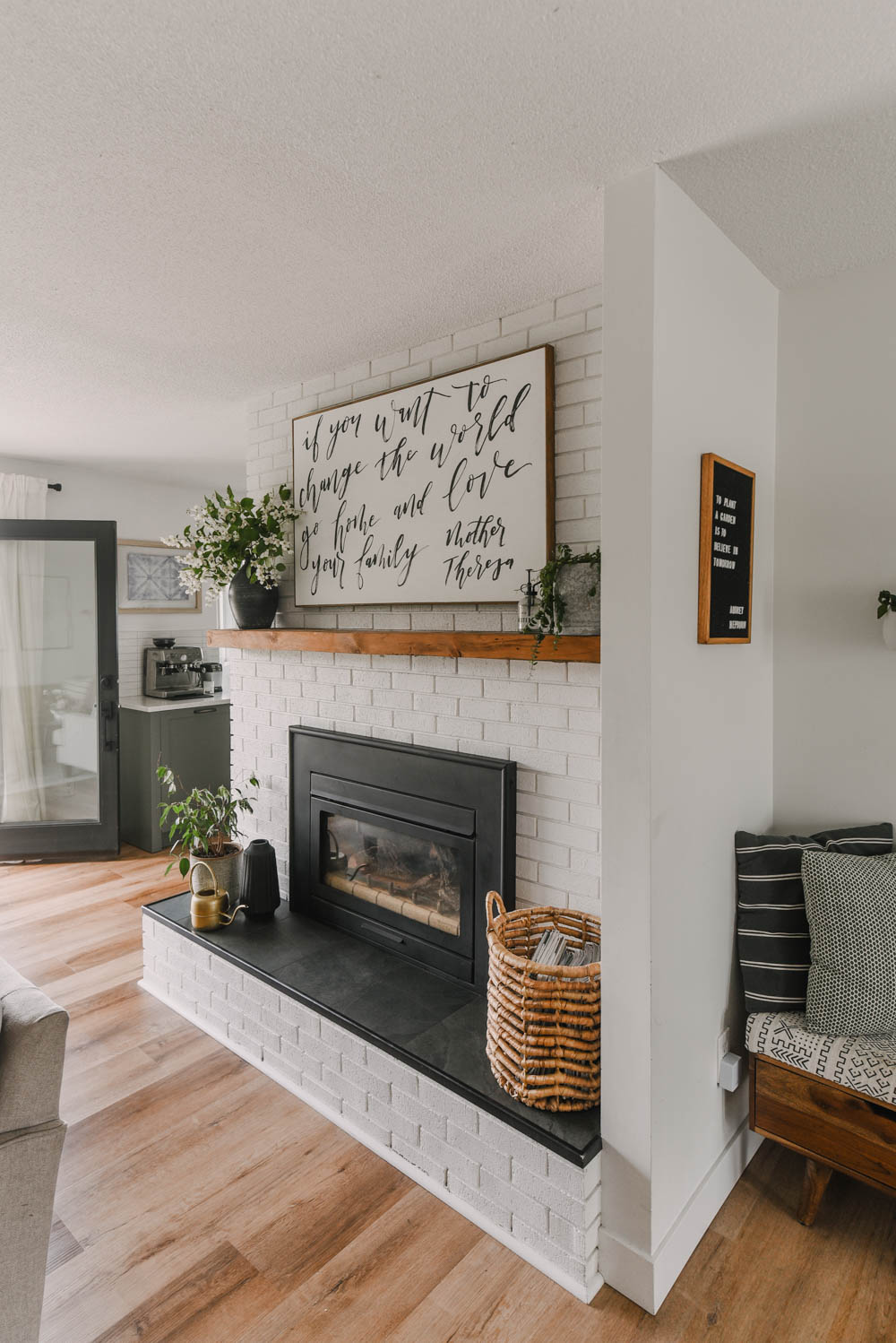 diy wall decor ideas - photo of hand painted canvas over fireplace and textile art on adjacent wall