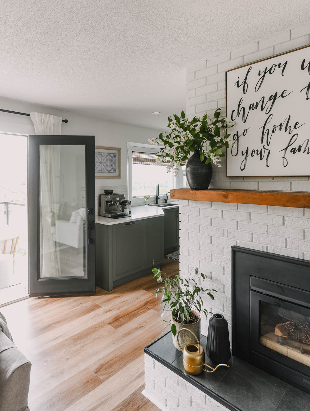 patio doors open to brick fireplace