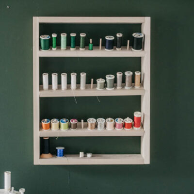 Free plans for a DIY thread shelf... with dowels to hold on thread