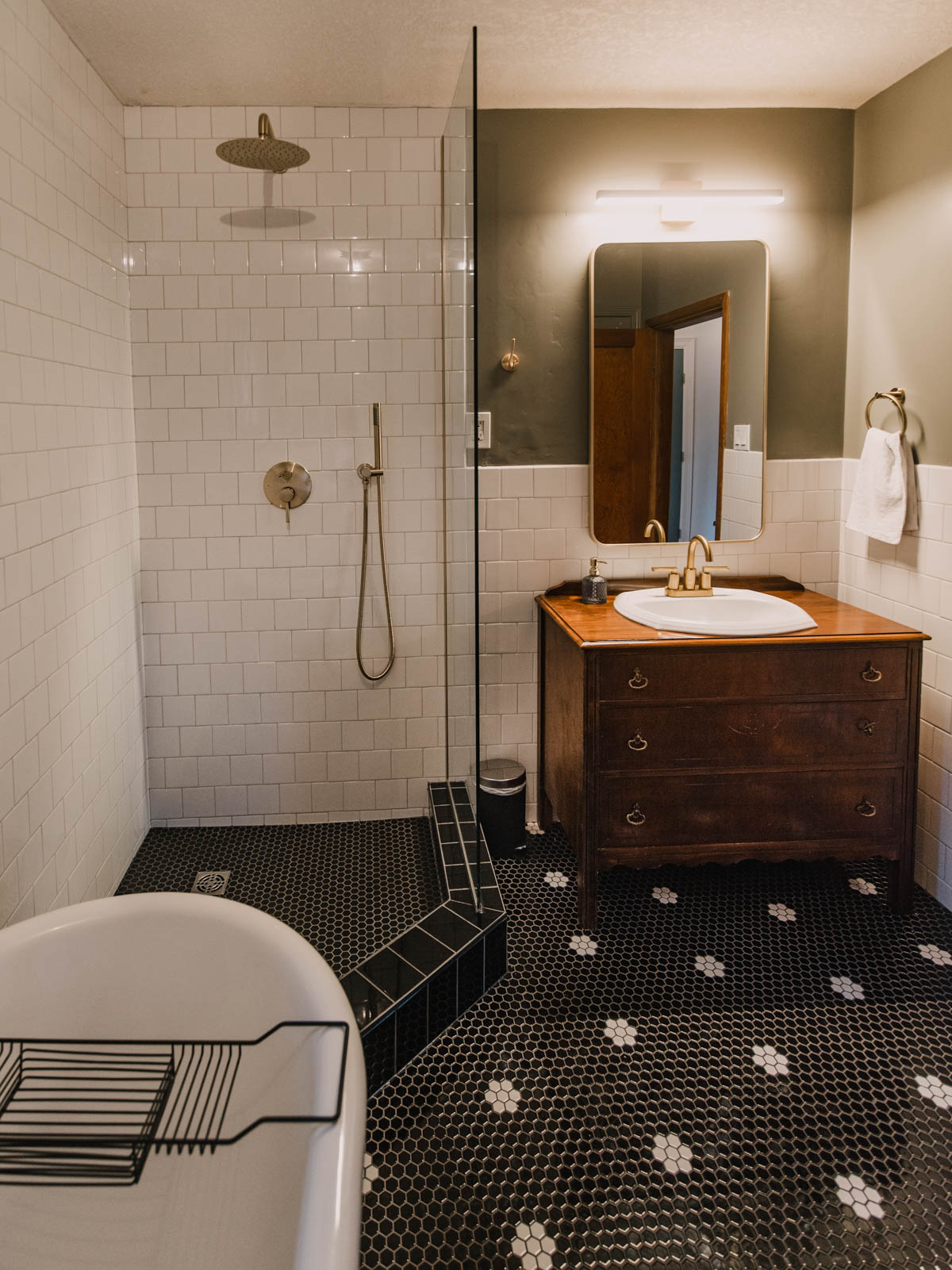 open bathroom design with glass panel and rain shower