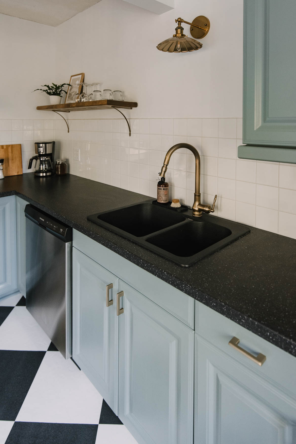 Blue cabinets and checkerboard floors in a 1945 renovation