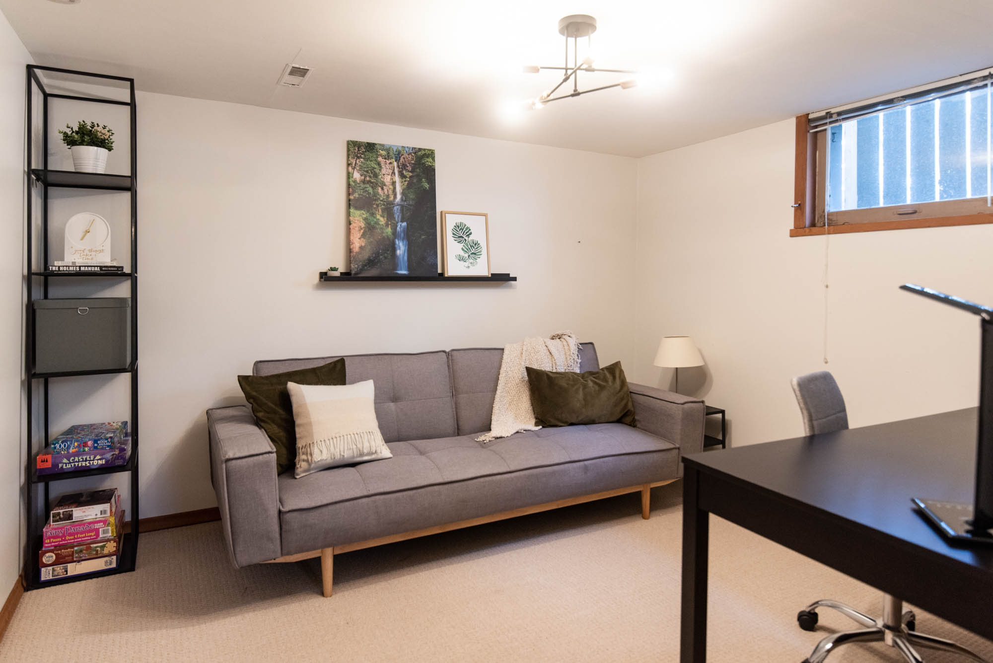 Office with futon and picture ledge for extra beds in an airbnb