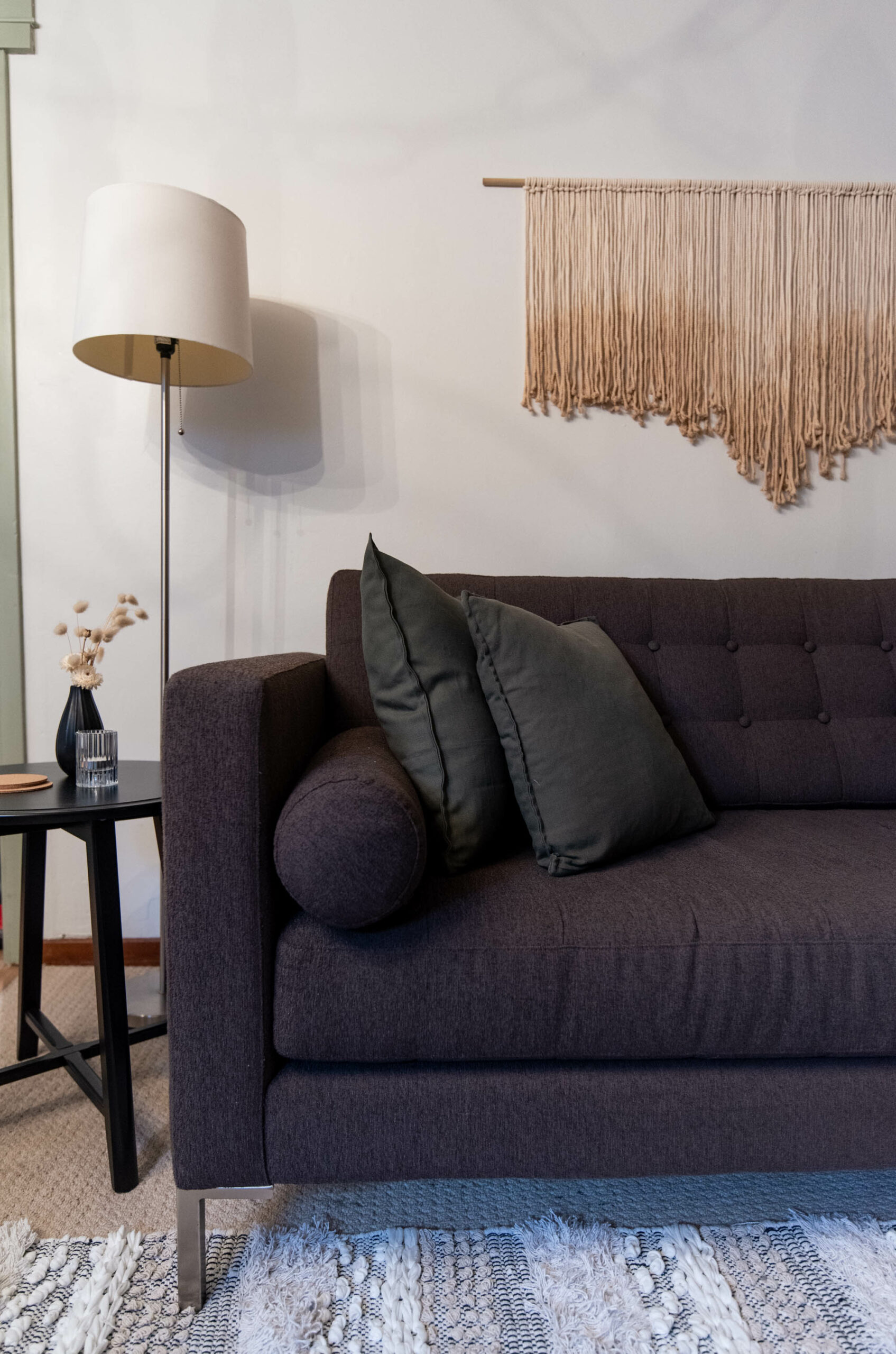 Modern basement suite update- macrame wall hanging and affordable furniture