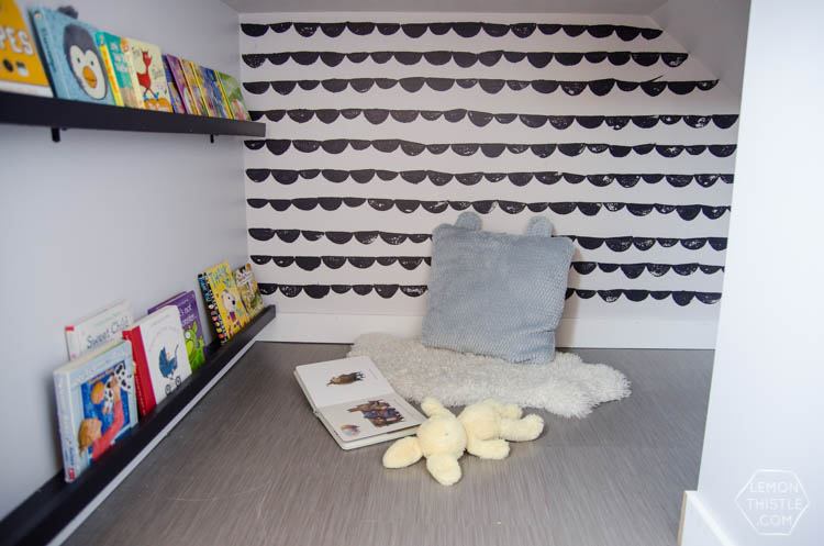 An under stairs nook for kids to play! I love the hand stamped 'wallpaper'. Click through for full tutorial
