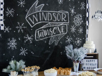 What a clever idea! Using a dropcloth to create a DIY giant chalkboard backdrop for birthday party decorations! Perfect for this modern winter wonderland!